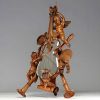 Carved wood violin mirror decorated with cherubs and musical instruments, 19th century.