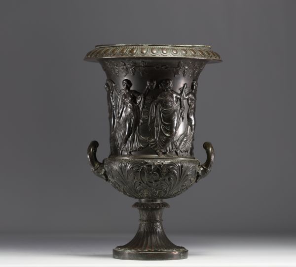 A Medici vase in bronzed brass with a black patina, decorated with a Bacchanalian frieze in the antique style, 19th century.