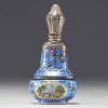 A rare silver and guilloché enamel salt flask decorated with flowers and landscape scenes, 19th century.