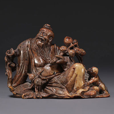 China - Dignitary with monkey in hard stone, representing three characters, 18th-19th century.