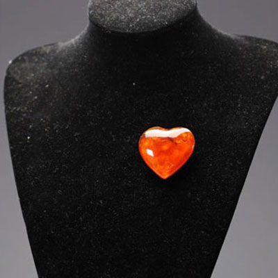 Yves SAINT LAURENT - Heart brooch in imitation amber and gilded metal.