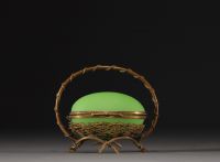 A Napoleon III period egg-shaped jewellery box in green opaline Palais Royal with brass mount.