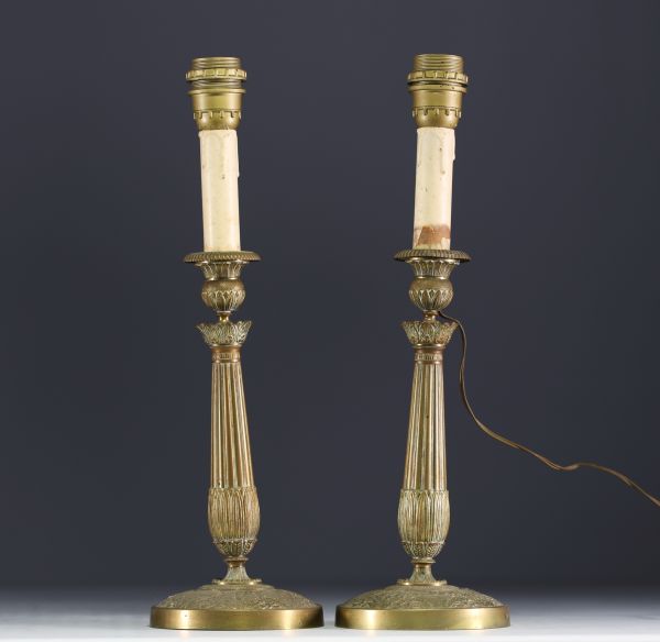 A pair of bronze candlesticks in the Restoration style, 19th century.