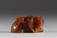 China - Amber jade sculpture representing a tiger and insects.