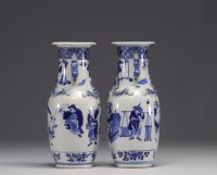 China - Pair of blue-white porcelain vases with figures, Kangxi mark, 19th century.