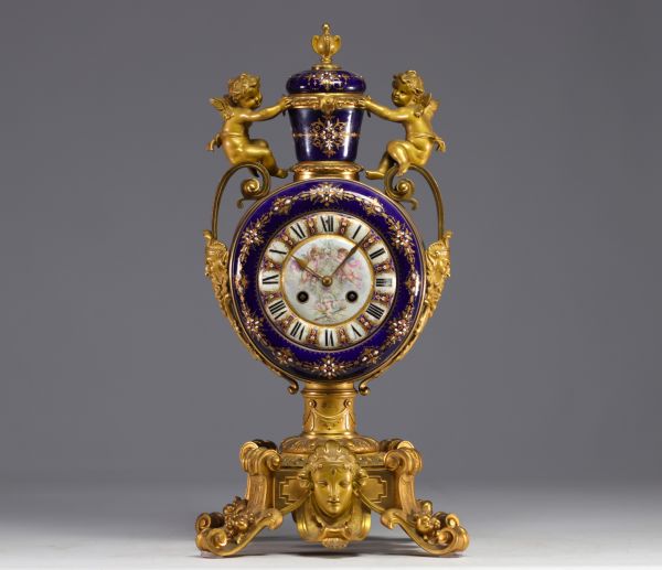 A rare Sèvres porcelain and gilt bronze clock decorated with cherubs.