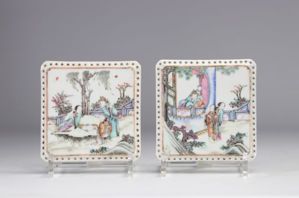 China - A pair of Famille Rose porcelain plaques decorated with figures.