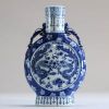 China - White-blue porcelain vase with dragon decoration, Kangxi.