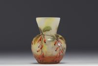 DAUM Nancy - Small vase in enamelled marbled glass decorated with small berries, signed.