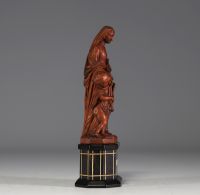 Vierge à l'enfant en buis sur socle en bois noirci, plaquette en os 