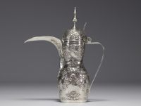 An ottoman silver embossed coffee pot decorated with flowers, scrolls and acanthus leaves. Orient, 19th century.