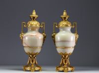 Imposing pair of Louis XVI chased gilt bronze and onyx cassolettes.