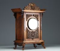 Carved exotic wood clock in the style of Gabriel Viardot with chinoisant decoration, elephant head feet, 19th century.