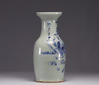 China - A blue-white porcelain vase on a celadon background decorated with figures, 19th century.