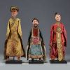 China - Set of three theatre puppets in traditional costume, lacquer and silk, 19th century.