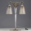 Muller Frères Lunéville - Art Deco double lamp in hammered metal and pair of stylized globes, signed.