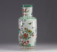 China - A green family porcelain vase decorated with trees and birds, early 20th century.