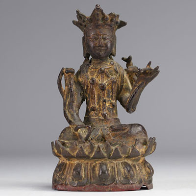 Statue of a traditional seated figure in bronze originating from China from the Ming period  (明朝)