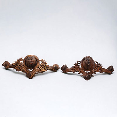 Pair of Black Forest coat hangers decorated with bear heads and edelweiss.