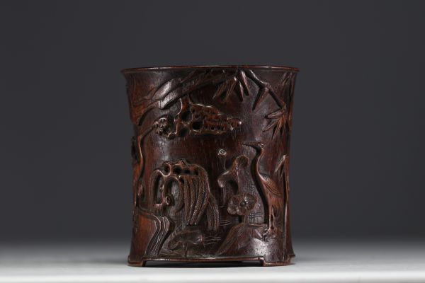 China - A carved wooden brush pot with bamboo and bird decoration, 19th-20th century.