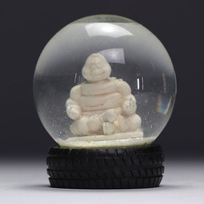 MICHELIN snow globe representing the Michelin Man in lotus position with a base in the shape of a tyre from 2007