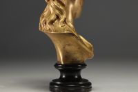 Bust of a young girl in bronze with gilded patina, published by the 