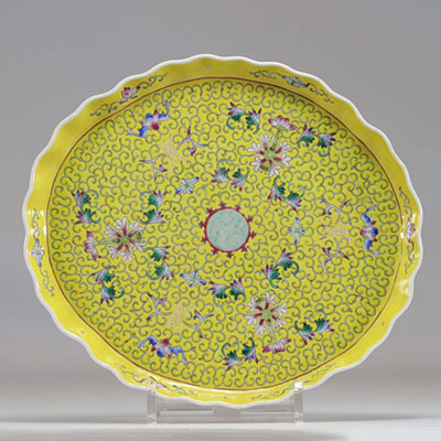 Chinese famille rose porcelain tray on a yellow background decorated with flowers