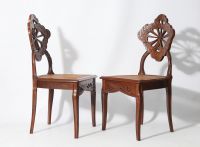 Émile GALLÉ (1846 - 1904) ‘Ombelles’ model Exceptional pair of solid walnut chairs, circa 1903-1904