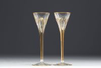 Elegant carafe in cut glass enhanced with gold and eight glasses.