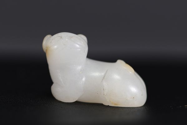 China - Small white jade pendant representing a cat, 18th century.