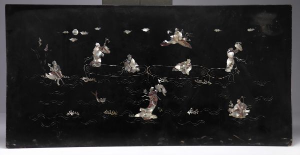 Southern China, Vietnam - A lacquer and mother-of-pearl panel decorated with figures at the water's edge, circa 1900.