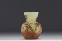 DAUM Nancy - Small vase in enamelled marbled glass decorated with small berries, signed.