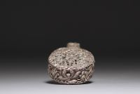 China - Carved silver incense bottle decorated with figures and elephants.