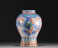 China - Polychrome porcelain vase decorated with figures and landscape, transition period.