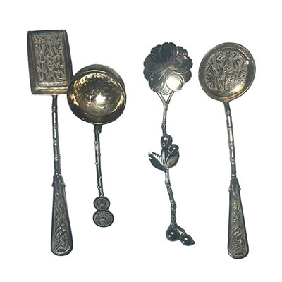 Asia - Set of four silver spoons decorated with bamboo and flowers.