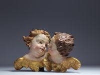 ‘Two heads of cherubs’ Polychrome wood carving, 18th century.