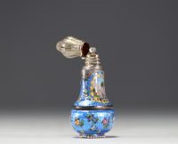 A rare silver and guilloché enamel salt flask decorated with flowers and landscape scenes, 19th century.