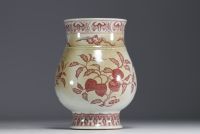 China - Iron-red porcelain vase decorated with fruit and bats, blue mark.