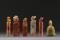 China - Set of five hard stone seals and a carved jade figure.