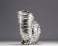 Nautilus-shaped champagne bucket on four small shell feet.