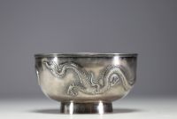 China - Large solid silver bowl decorated with dragons in relief.