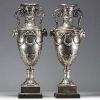 Imposing pair of Louis XVI chased and repoussé silver vases, hallmarks of Paris, 18th century.