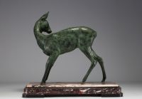 Large sculpture of a doe in green patina regula on a pink and black marble base, unsigned.