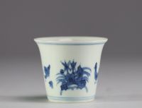 China - White-blue porcelain cup decorated with a rooster and hens.