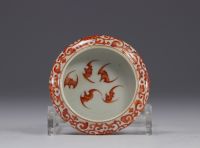 China - porcelain brushes decorated with red bats on a white background.