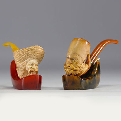 Set of two antique meerschaum pipes with figurative sheaths, 19th century.