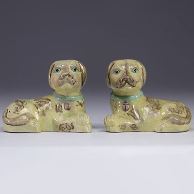 China - pair of glazed porcelain dogs with green collars.