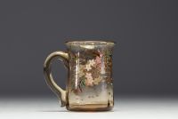 Cristallerie Émile GALLÉ (1846-1904) Small jug with flower decoration in blown and enamelled crystal, signed under the piece.