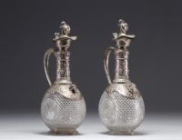 Pair of Baccarat crystal and silver wine decanters.