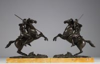 Pair of equestrian sculptures in bronze, figures in the antique style, on a marble base, Charles X period